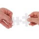 Two hands each holding a puzzle piece, bringing them together to connect.